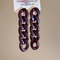 Macro view of long dark purple acrylic chain earrings with matte finish on display card - Matte Wine Red (Silver Pin)
