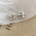 Detail of round silver metallic stud earrings featuring quilted checkerboard texture - Quilted Round Style (HE27804) / Silver