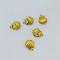 Golden seashell charm pendants with small ring clasps on a white background - Hollow Shell