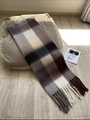 Thick purple and grey plaid scarf with tassels on a cozy sofa for winter warmth - AC Plaid Coffee
