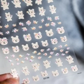 Self-adhesive nail art sticker KX100 featuring cute beige cartoon bears and flowers - KX100-Embossed Style