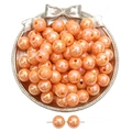 Pearlescent orange acrylic round beads for jewelry making in a silver decorative bowl - Orange