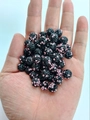 Macro detail of 10mm Shamballa clay beads with black base and pink rhinestone pavé - 10mm / Black + Light Pink