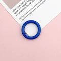 Close-up of a blue paint-coated 25mm round spring carabiner on pink background - Royal Blue