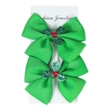 Set of two green Christmas hair bow clips with holly berry sequins on white background - Christmas Green