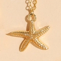 Golden starfish pendant necklace with detailed texture on a minimalist dainty chain - Textured Starfish
