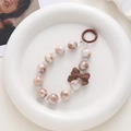 Iridescent beaded phone chain with a brown matte bow and a circular metal clasp - Brown Pendant (K1776)