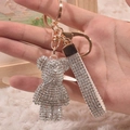 Sparkling crystal encrusted bear keychain with rose gold hardware and luxury wrist strap - Diamond White