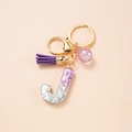 Letter J keychain with purple glitter resin, suede tassel and pink sequin ball accessory - Letter J