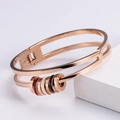 Elegant rose gold double-layer steel bracelet with multi-color enamel ring charms - Rose Gold