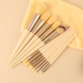 Set di 13 pennelli trucco beige con ghiere d'argento e panno per pulizia giallo - Set da 13 pezzi + Borsa / Giallo