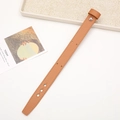 Detailed view of a brown leather wrist strap with adjustable holes on a white desk - Without Rivets / Light Brown