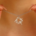 Close-up of silver stainless steel necklace featuring a hollow bird and branch pendant - Hollow Bird and Branch Pendant Necklace-Steel Color (1630)