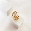 Conjunto de anillos apilables de titanio bañados en oro 18k con circonitas redondas - US 7 / B-Estilo de Piedras Paralelas Dorado
