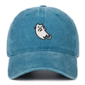 Detailed close-up of a white cartoon cat embroidery on a washed blue cotton baseball cap - Lake Blue