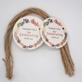 Detail of round Thank You tags with floral wreath and natural jute twine for party favors - 3-Round Floral Wreath
