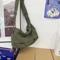 Army green washed canvas messenger bag with adjustable strap and minimalist flap design - Green