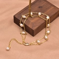 Elegant gold double-layer chain bracelet featuring irregular white freshwater pearls - Double Layer Bracelet Set