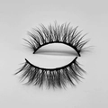 Macro detail of fluffy black false eyelashes with wispy curls and winged outer corners - D233N