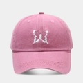 Close-up of intricate white butterfly embroidery on a pink washed cotton baseball cap - Adjustable / Pink