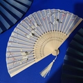 Bamboo folding fan with blue silk crane floral pattern and white tassel detail - Light Blue Crane Plum
