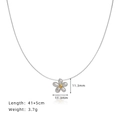 Silver daisy flower pendant necklace in titanium steel with gold center and size data - Silver
