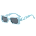 Light blue rectangular sunglasses with unique flame-shaped cutout arms and dark grey lenses - Blue Frame Grey Lens