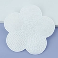 Flower-shaped silicone makeup brush cleaning mat with suction cup in white finish - White