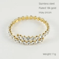 Detailed macro view of 18k gold plated stainless steel bracelet with inlaid zircons - White Zirconia