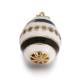 Detailed close-up of a gold-plated egg pendant with black enamel stripes and crystal stones - Black and White Striped Egg Pendant