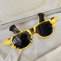 Kids giraffe shaped yellow sunglasses with black spots and 3D ears on white fabric - Yellow Giraffe Style
