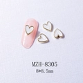 Macro detail of white heart nail charms with gold borders, model MZH-8305, 8x8.5mm - 8305 Gold Border White Shell (8*8.5mm)