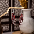 Ethnic style silver-plated peacock earrings with vibrant red rhinestones and bells - Red Rhinestone Antique Silver Peacock