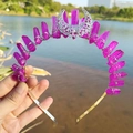 Detailed view of handmade purple crystal moon crown with silver wire wrapping - Fuschia