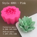 Pink silicone mold next to green succulent candle showing dimensions 7.2x7.1x4.1 cm - Model 6991 / Pink