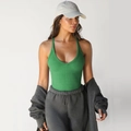 Slim fit Y2K knitted green ribbed tank top paired with grey hoodie and joggers - Green