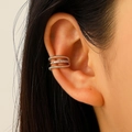 Three-layer gold ear cuff with braided textures and sparkling zircon stones on model - Gold Triple Layer Twist Zircon Style (M-043)