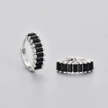 Macro detail of silver rectangular earrings with black baguette-cut zircons on gray background - Rectangular Ear Buckles / Platinum Black Zirconia
