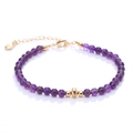 Elegant purple crystal bead bracelet with gold metal accents and a heart charm - Purple Crystal