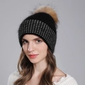 Women's black knit winter hat with large raccoon fur pompom and silver sequins accents - Black