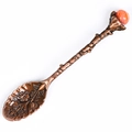 Vintage bronze coffee spoon with ornate floral carvings and a polished red agate stone - Crushed Stone Style / Red Agate
