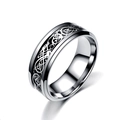 Macro view of stainless steel ring featuring intricate silver Celtic dragon pattern inlay - Silver With Black Inlay Silver Dragon