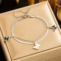 Detail of double-layer stainless steel bracelet with black and white butterfly charms - Silver Double-layer Butterfly Style (B1377)