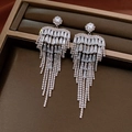 Close-up of silver tassel bow earrings with sparkling rhinestones in a dark jewelry box - Bowknot Gorgeous Tassel (26#)