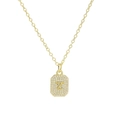 Macro shot of gold square pendant featuring a crystal-paved letter Z and fine link chain - Necklace Z