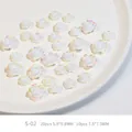 Detailed view of 3D resin camellia nail charms with white aurora pearlescent finish - Camellia Mixed Iridescent White (S-02)
