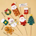 8-piece Christmas cupcake topper set with Santa, Snowman, and Gingerbread Man designs - Climbing Santa & Snowman Topper Kit 1 Set