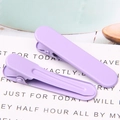 Close-up of two lavender matte seamless duckbill hair clips on a decorative card - 1.3x4.9cm / Light Purple