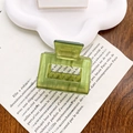 Translucent green square acetate hair claw clip on a minimalist ceramic cloud plate - New Green