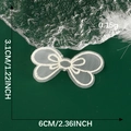 Detailed size view of white embroidered bow lace patch measuring 6cm by 3.1cm for DIY sewing - White Mesh Bow Style B (13)